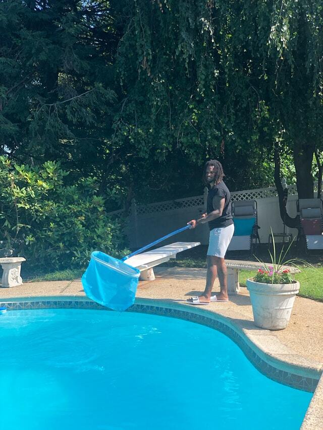 cleaning the pool before the party